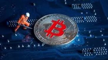 Symbol of construction industry - a man lifting a huge coin