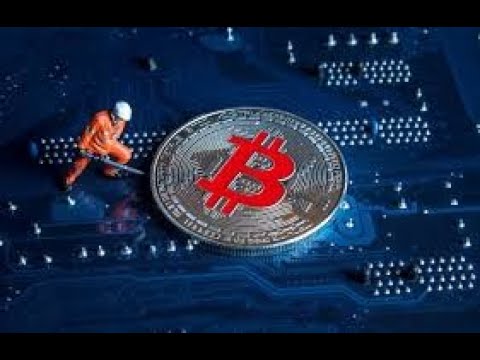 Symbol of construction industry - a man lifting a huge coin