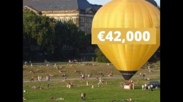 Judgement mortgage - hot air balloon on a field full of people