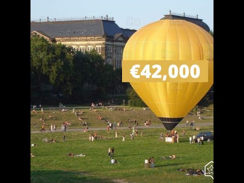Judgement mortgage - hot air balloon on a field full of people